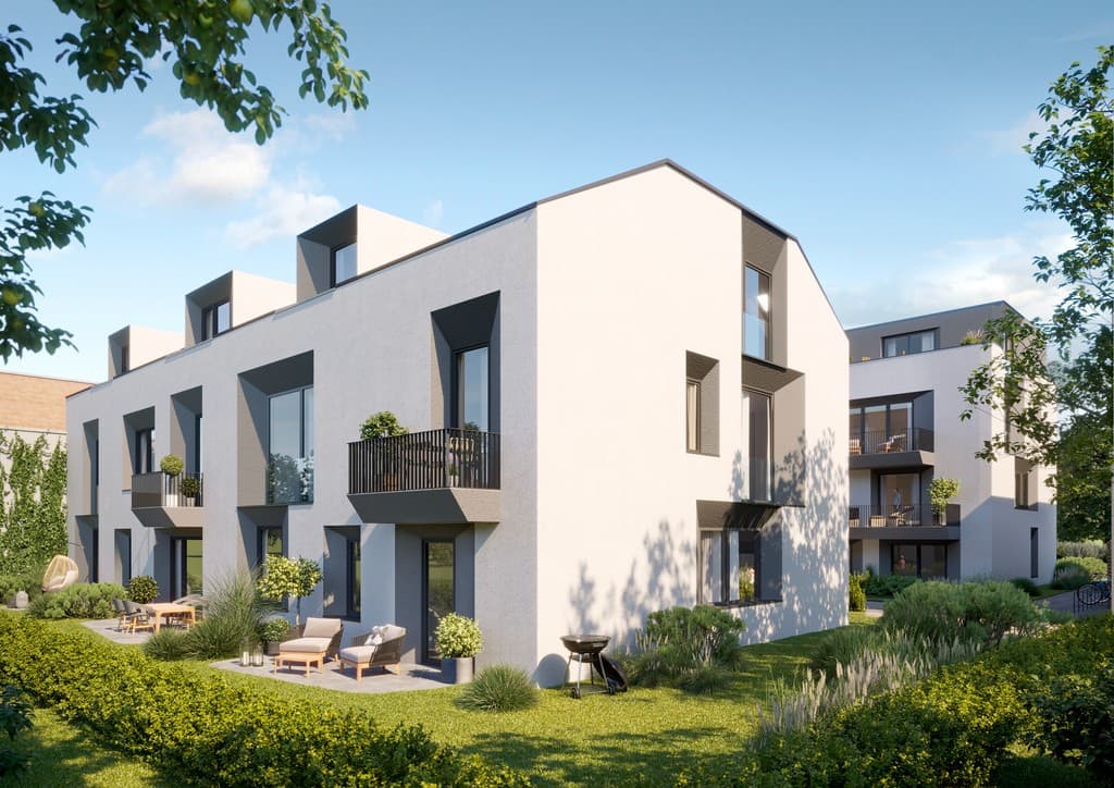 Modernes Gebäudeensemble H6 in Berlin mit Stein- und Glasfassade.